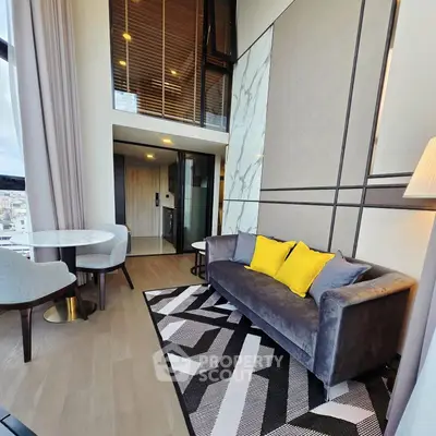 Modern living room with stylish decor and high ceiling in luxury apartment