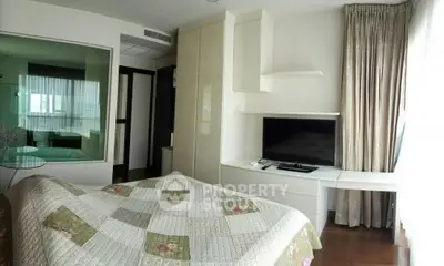 Modern bedroom with large window and built-in storage