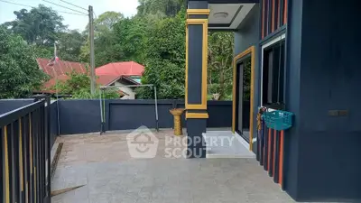 Spacious balcony with elegant design and lush greenery view