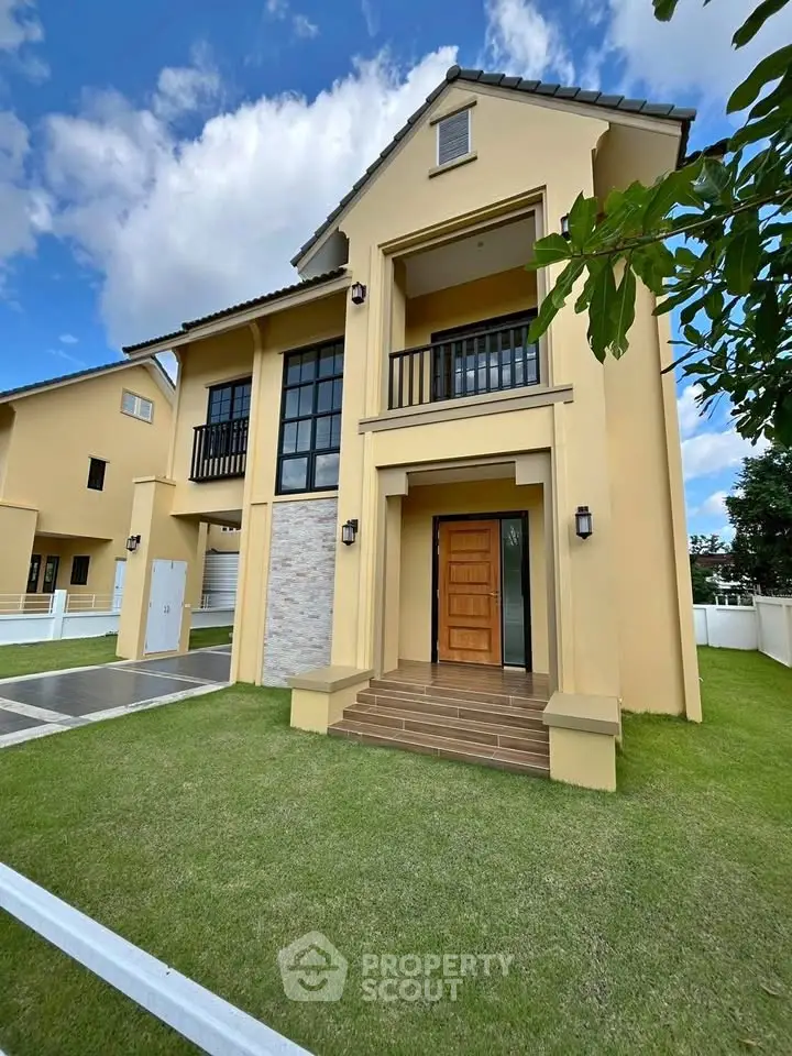 Stunning modern two-story house with elegant facade and lush green lawn, perfect for family living.