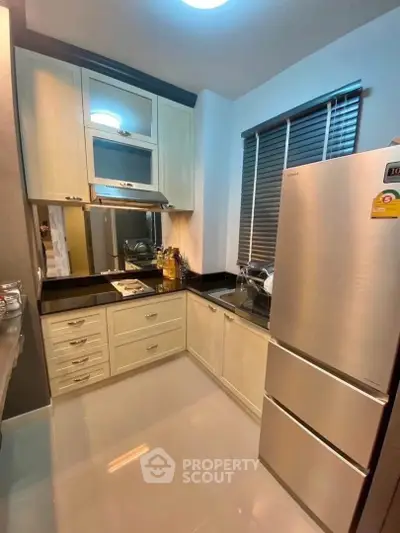 Modern kitchen with sleek cabinets and stainless steel appliances