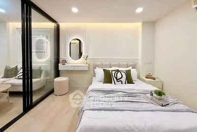 Modern bedroom with stylish decor and glass partition in a cozy apartment.