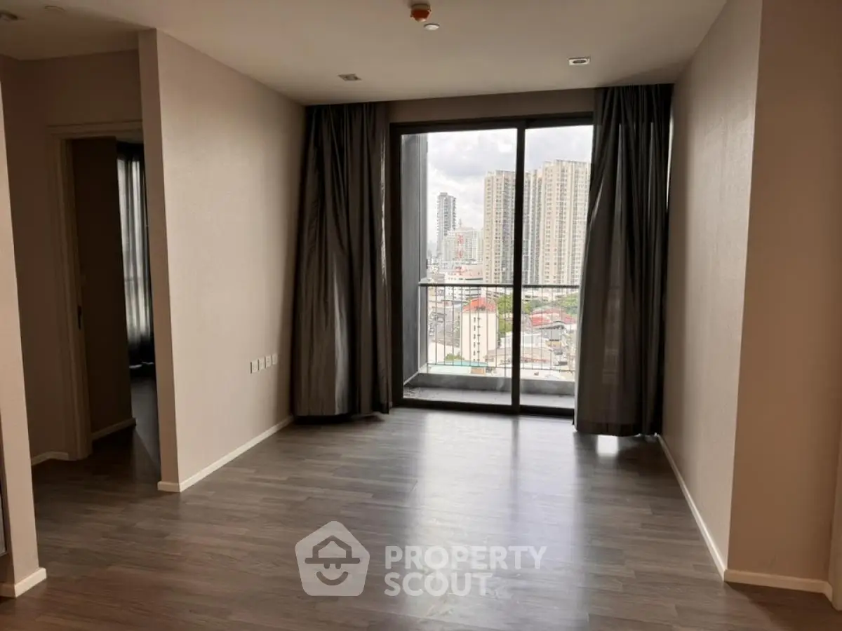 Spacious modern apartment with large windows and city view
