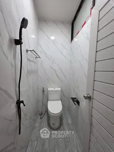 Modern bathroom with sleek marble tiles and contemporary fixtures