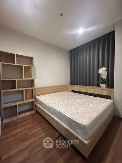 Modern bedroom with sleek design and wooden flooring