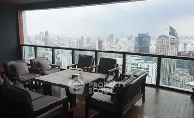 Luxurious high-rise balcony with stunning city skyline view and elegant seating area.