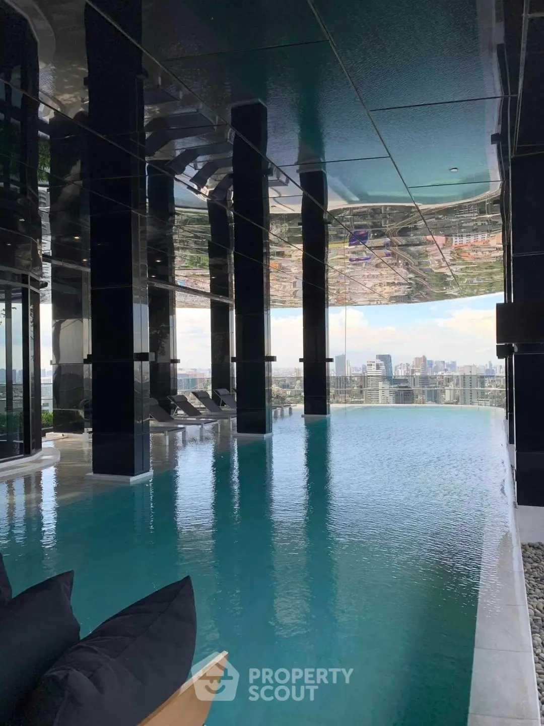 Luxurious rooftop infinity pool with stunning city skyline views