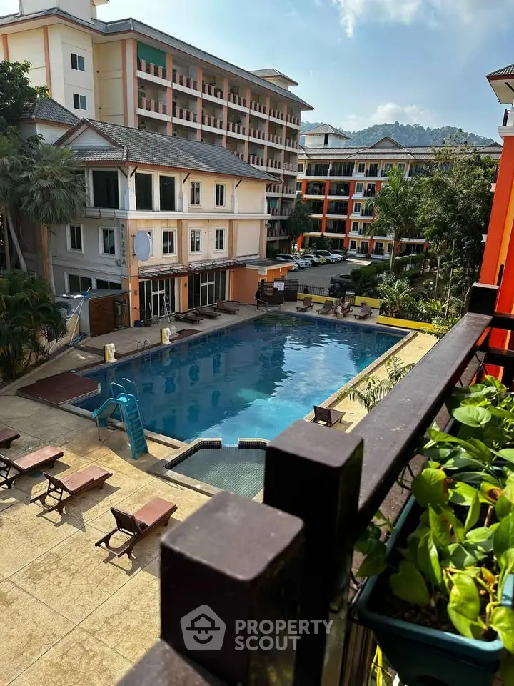 Luxurious apartment complex with poolside view and lush greenery, perfect for relaxation and leisure.