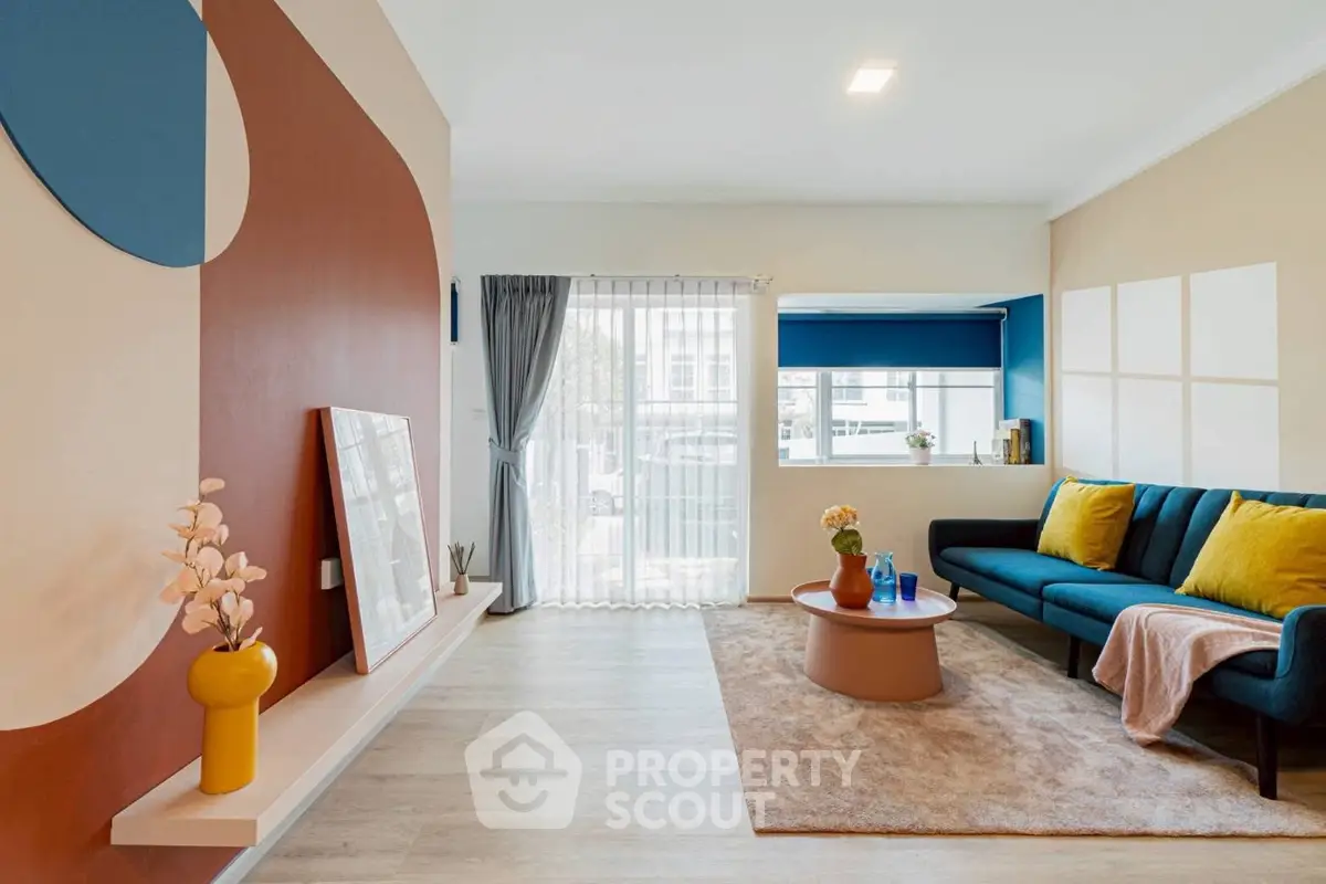 Stylish modern living room with colorful decor and natural light