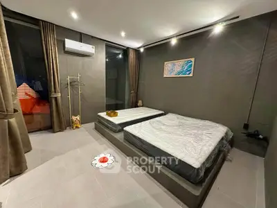 Modern bedroom with minimalist design and large windows in a stylish apartment.