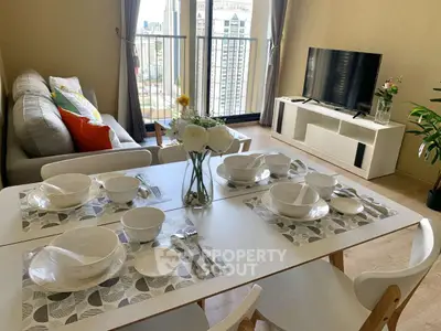 Modern living room with dining area and balcony view in a stylish apartment