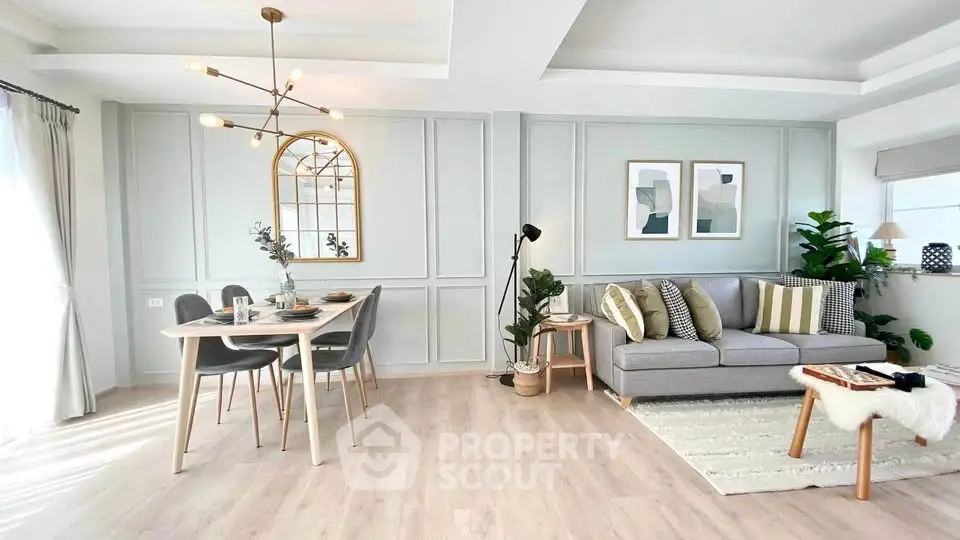 Stylish modern living room with elegant dining area and chic decor