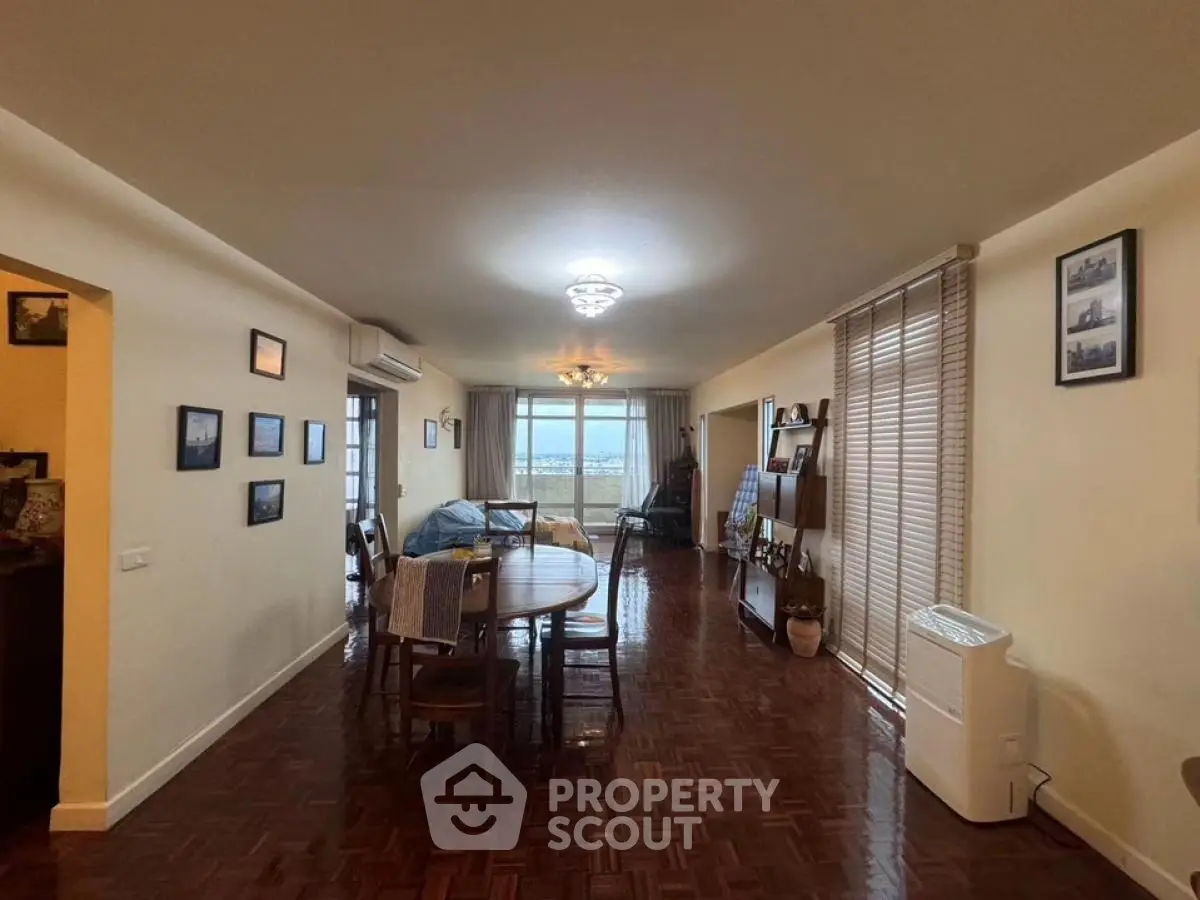 Spacious living room with elegant decor and large windows offering stunning views