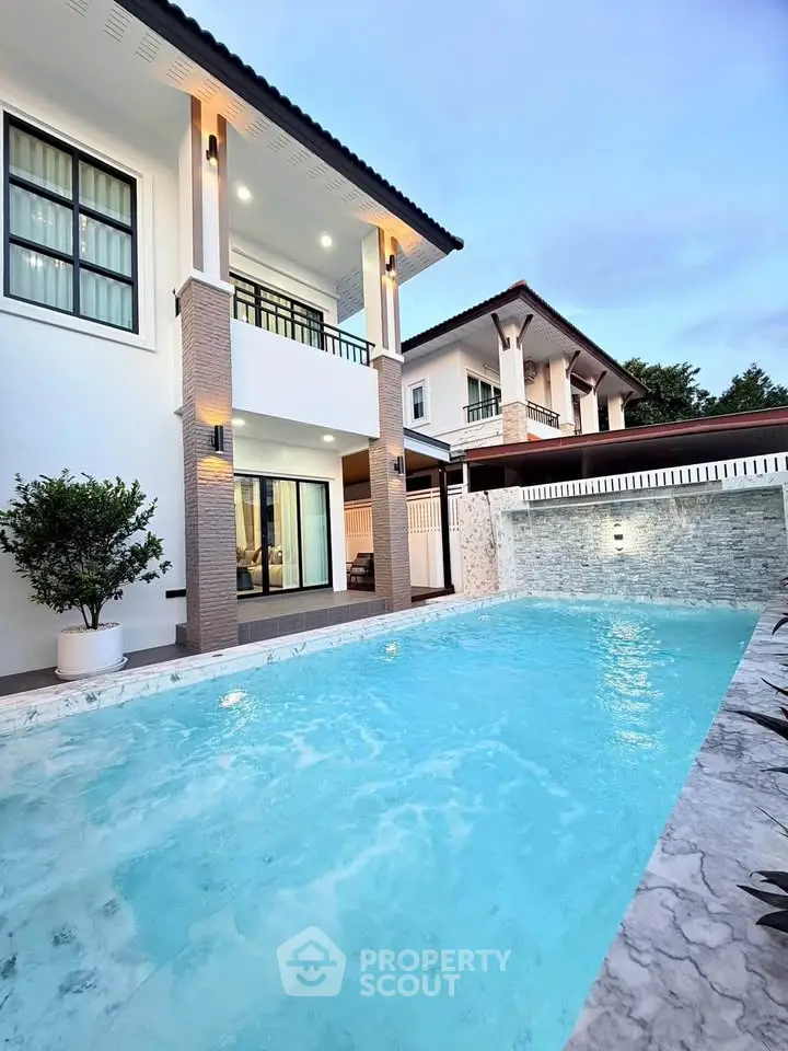 Luxurious modern home with private pool and elegant exterior design, perfect for upscale living.