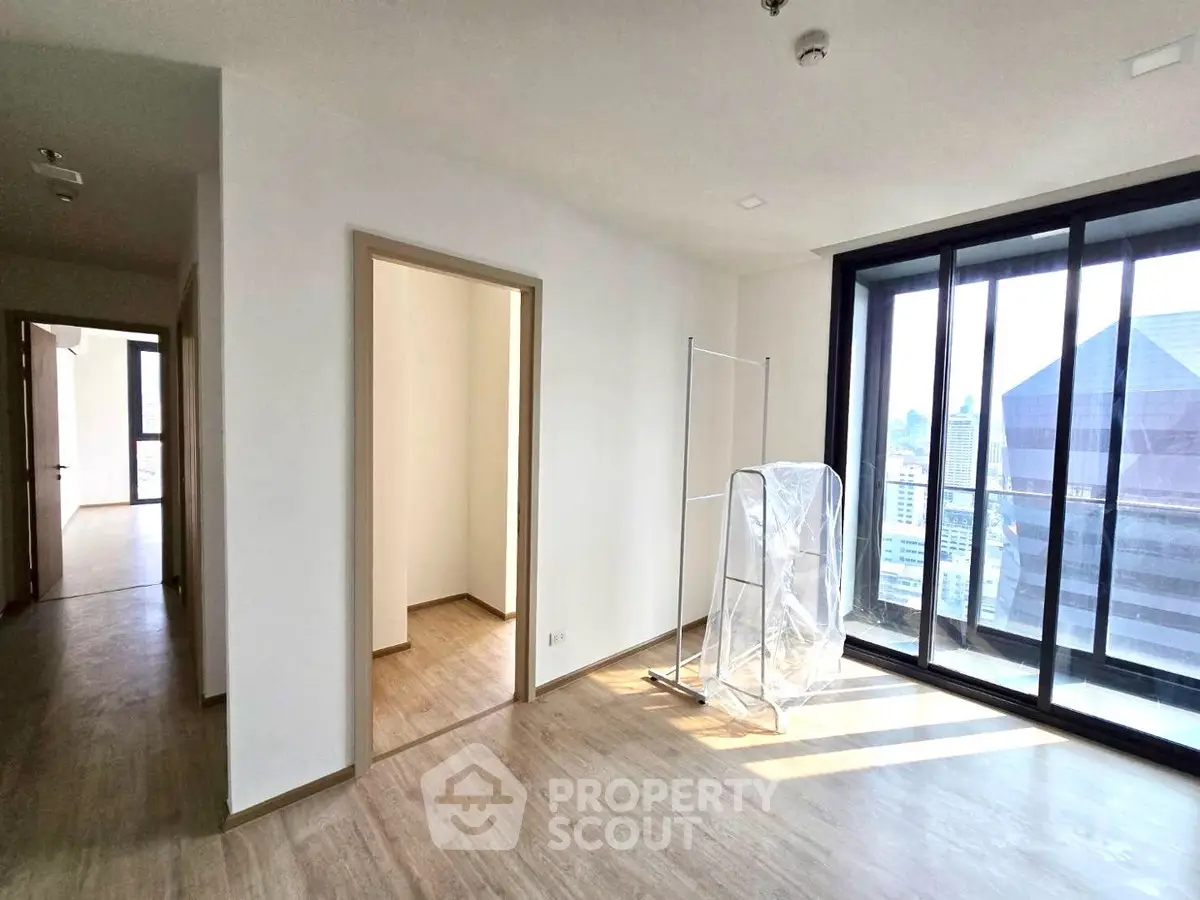 Spacious modern apartment with large windows and city view