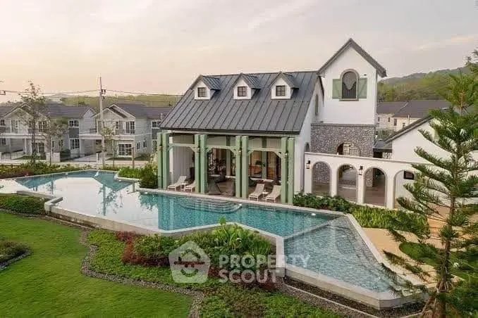 Luxurious villa with stunning pool and lush garden in serene neighborhood setting.