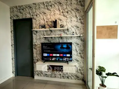 Modern living room with stylish marble accent wall and mounted TV