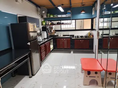 Spacious modern kitchen with sleek appliances and ample storage