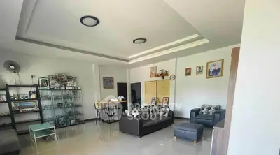 Spacious living room with modern decor and ample natural light