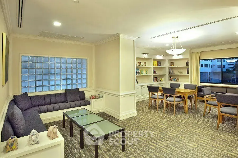 Elegant study room with built-in bookshelves and modern furniture in a cozy setting.