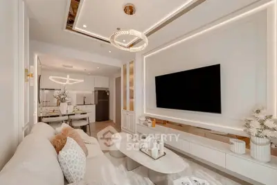 Luxurious modern living room with elegant decor and open kitchen layout, featuring stylish lighting and plush seating.