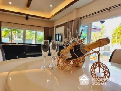 Luxurious living room with elegant decor and champagne set, perfect for entertaining.