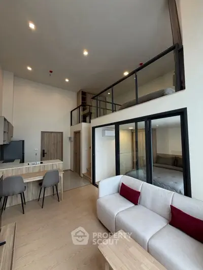 Modern loft apartment with open living area and mezzanine bedroom