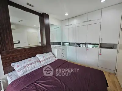 Modern bedroom with built-in wardrobe and stylish decor