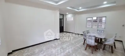 Spacious modern living room with elegant dining set and marble flooring