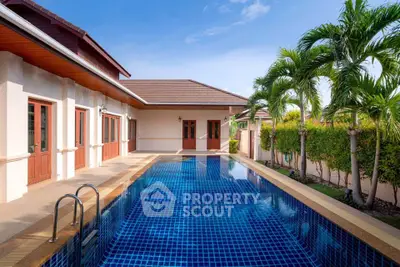 Luxurious villa with private pool and lush garden in tropical paradise.