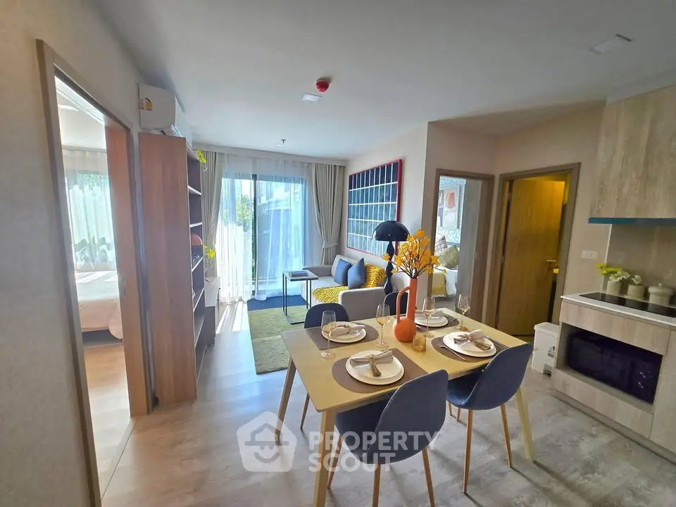 Modern open-plan living and dining area with stylish decor and natural light.