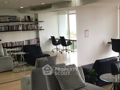 Modern living room with large mirror and cozy seating area