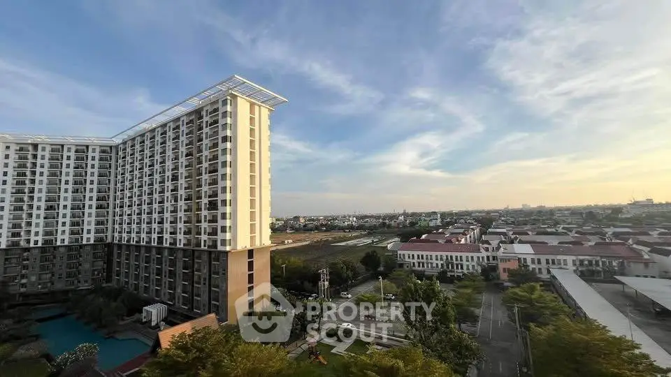 Stunning high-rise building with panoramic city views and lush greenery, perfect for urban living.