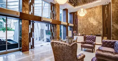 Luxurious hotel lobby with elegant seating and chandeliers