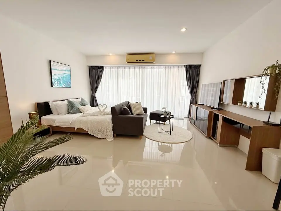 Spacious modern living room with elegant decor and natural light