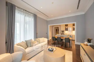 Elegant living room with open kitchen and modern decor