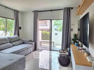 Modern living room with large windows and sleek furniture