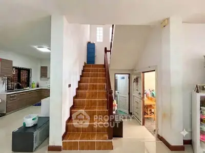 Spacious interior with staircase and modern kitchen in a cozy home