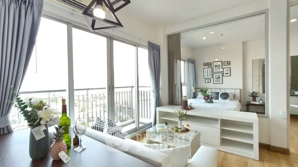 Modern open-plan living room with balcony and stylish decor