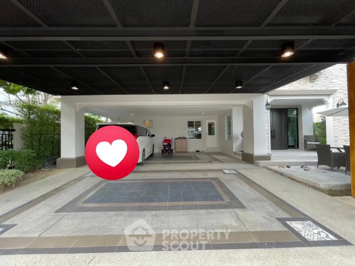 Spacious modern carport with elegant tile design and ample parking space.