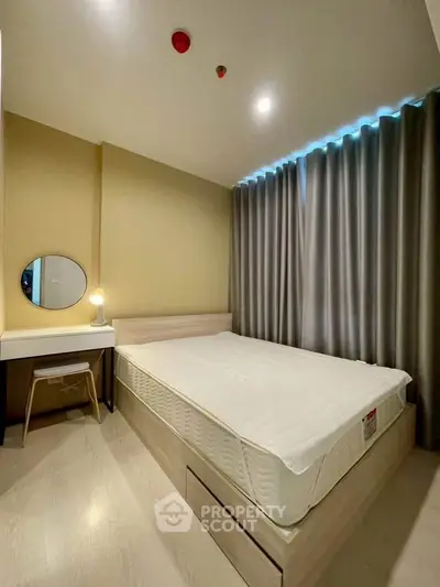 Modern bedroom with minimalist design, featuring a cozy bed, stylish curtains, and a sleek dressing table.