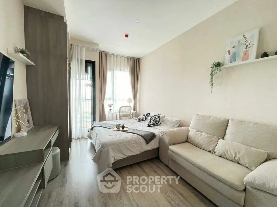 Modern living room with cozy sofa and stylish decor in a bright apartment.