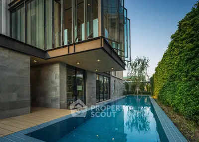 Luxurious modern home with private pool and lush garden view