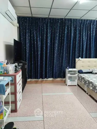 Cozy bedroom with starry curtains and modern furnishings