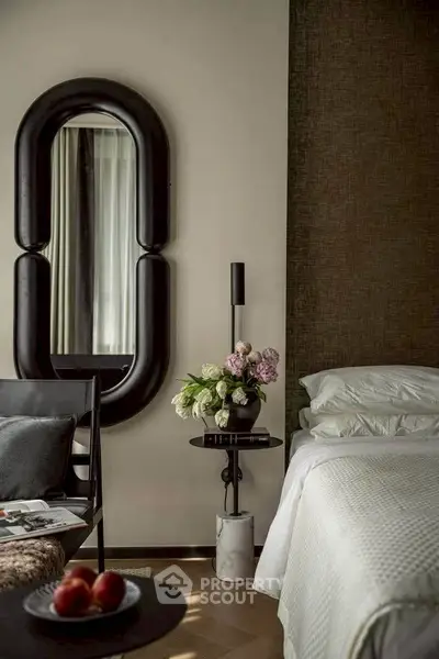 Luxurious bedroom with elegant decor and stylish mirror