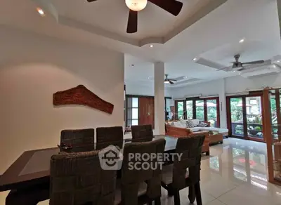 Spacious living room with elegant dining area and garden view