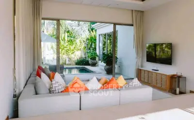 Luxurious living room with pool view and vibrant decor
