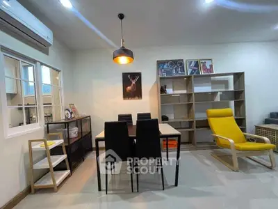 Modern living room with stylish furniture and wall art in a cozy apartment