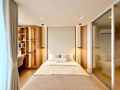 Modern bedroom with cozy decor and built-in study area, featuring elegant lighting and wooden accents.