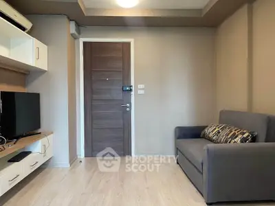 Cozy living room with modern decor and comfortable seating in a stylish apartment.